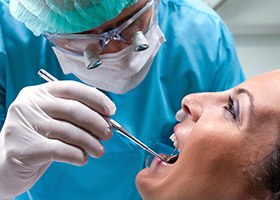 Dentist examining patient