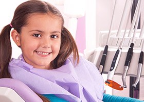 Little girl smiling in dental chair