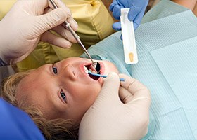 Child receiving fluoride treatment