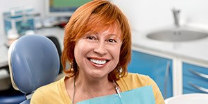 Smiling senior woman in dental chair